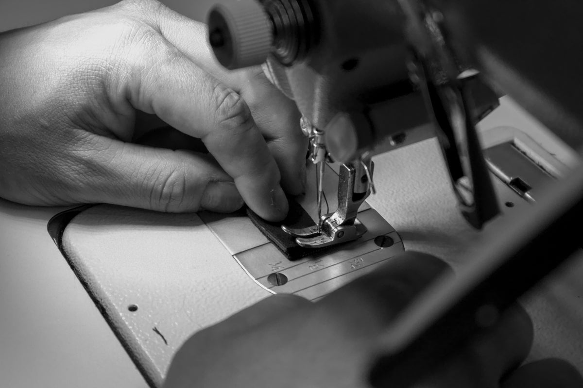 Hand-stitching Shamma sandals in the Santa Cruz workshop