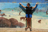 Woman wearing Shamma All Browns mural