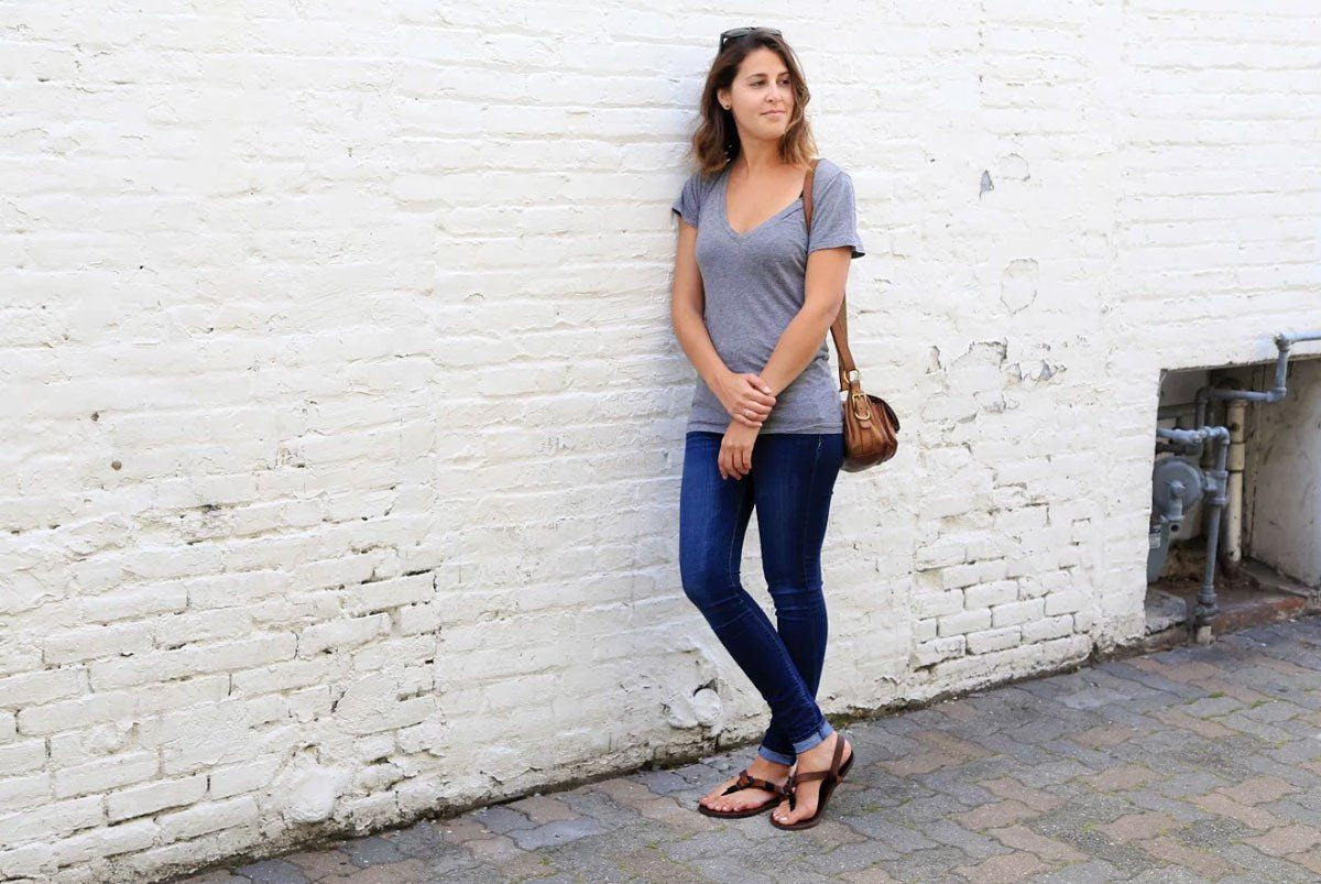 Woman in Shamma All Browns sandals standing downtown